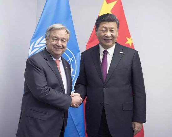 ——会见联合国秘书长古特雷斯，表明中国坚持多边主义、支持联合国发挥更大作用的坚定态度。
